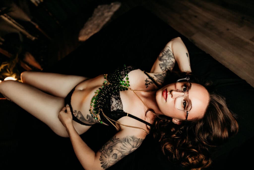 Woman smiling during a boudoir photography session in Manitowoc, WI